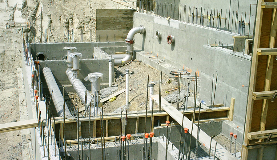 Concrete forming and pipe installation by Cumming Construction