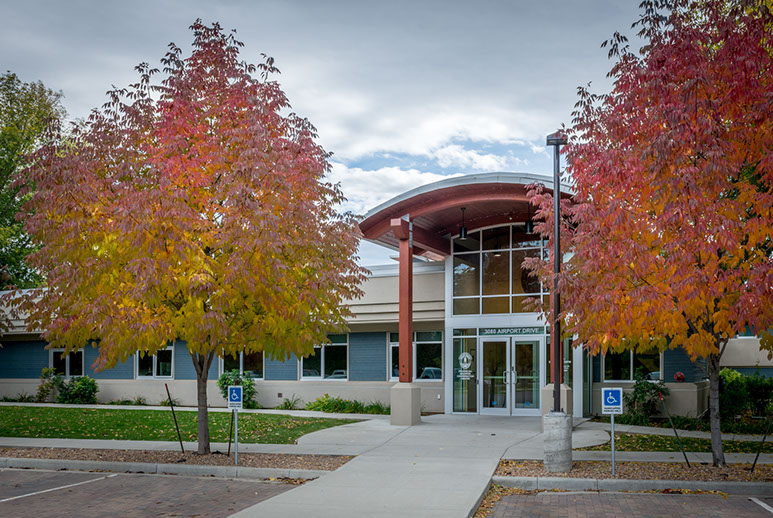 Airport Drive commercial building — contemporary architecture with curved canopy entrance